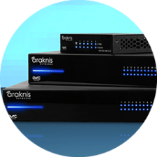 Three black network devices with blue LED indicators are stacked against a light blue background. The devices are branded with "Araknis Networks."