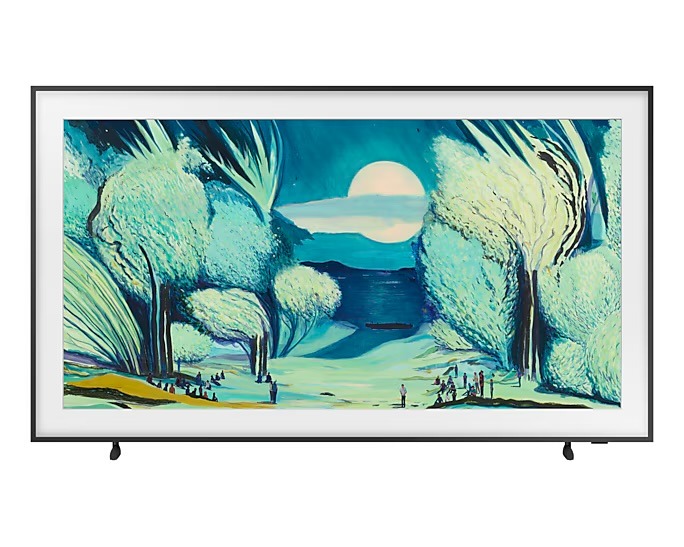 A TV framed painting depicts a serene, surreal landscape with large trees, a full moon, and small figures under an ethereal, blue-green sky. Samsung 2025 TV for your home