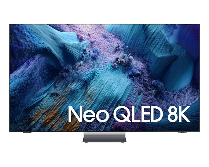 The image shows a Samsung Neo QLED 8K TV displaying vibrant, abstract oceanic scenery with blue and purple hues. No people or landmarks present Best Samsung 2025 TV for your home
